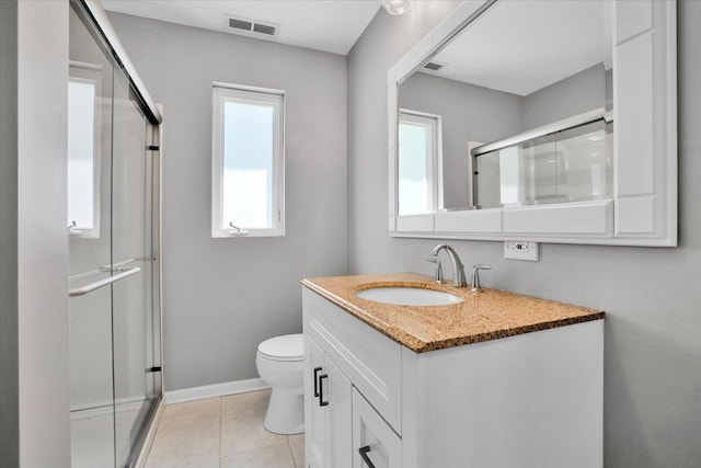 2425 W Riverside Dr, Mchenry, IL 60050 - full bathroom with vanity, a stall shower, toilet, and baseboards