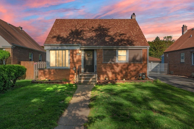 1678 State Line Rd, Calumet City, IL 60409 - view of front of home featuring brick siding, a gate, a chimney, a garage, and entry steps