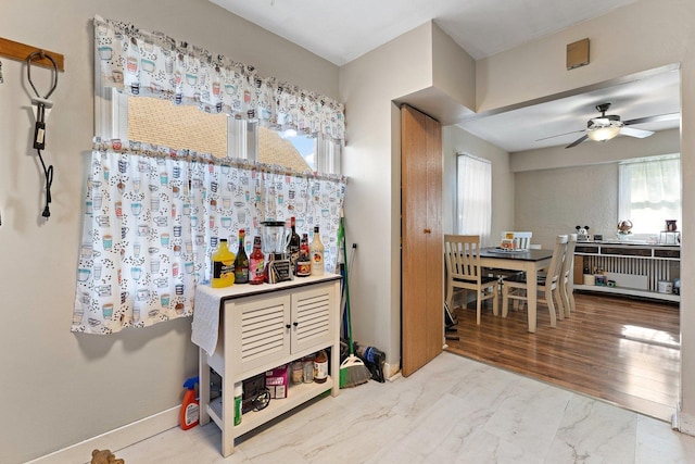 1678 State Line Rd, Calumet City, IL 60409 - bar with ceiling fan and marble look tile flooring