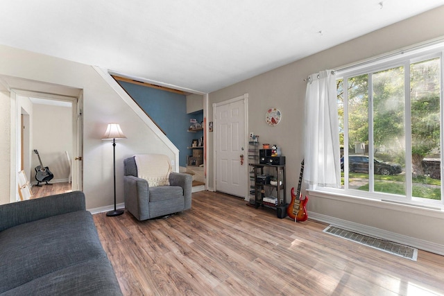 1678 State Line Rd, Calumet City, IL 60409 - living area featuring wood finished floors, plenty of natural light, and baseboards