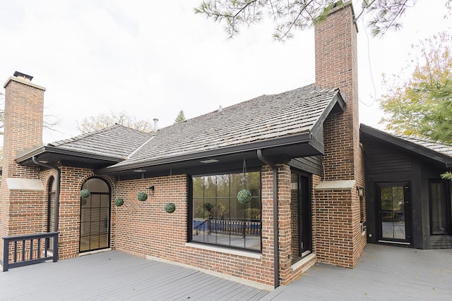 1620 Devonshire Ln, Lake Forest, IL 60045 - back of property featuring a chimney, brick siding, and a deck