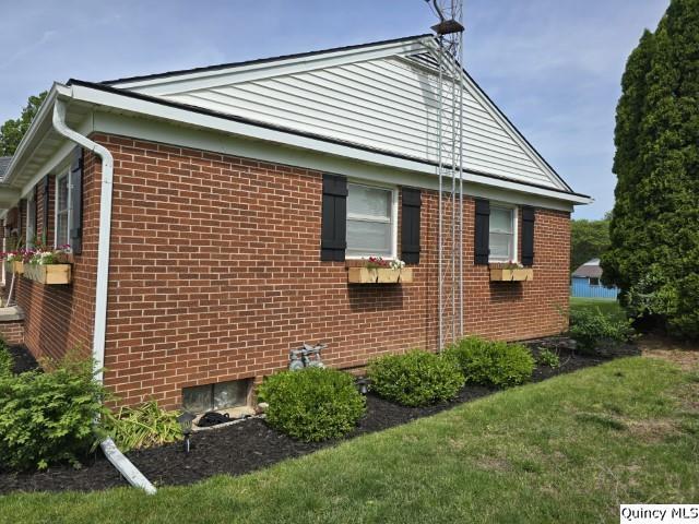 202 W Archer Ave, La Harpe, IL 62321 - view of side of property featuring brick siding and a lawn