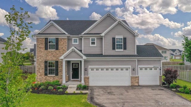 16017 S Crescent Ln, Plainfield, IL 60586 - view of front facade featuring brick siding, driveway, and an attached garage