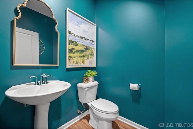 16017 S Crescent Ln, Plainfield, IL 60586 - bathroom with wood finished floors, toilet, and baseboards