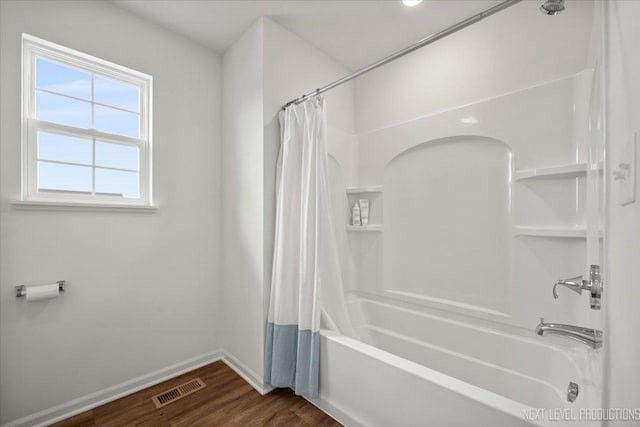 16017 S Crescent Ln, Plainfield, IL 60586 - bathroom featuring shower / tub combo with curtain, baseboards, and wood finished floors