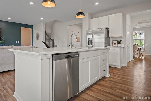 16017 S Crescent Ln, Plainfield, IL 60586 - kitchen with appliances with stainless steel finishes, a sink, open floor plan, dark wood-style flooring, and recessed lighting
