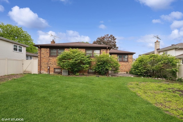 1237 N Ridge Ave, Arlington Heights, IL 60004 - rear view of house featuring brick siding, central AC unit, and a chimney
