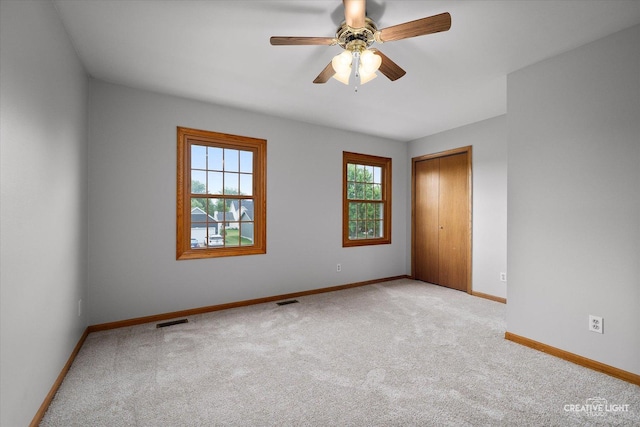 1345 William St, Sycamore, IL 60178 - empty room with carpet and a ceiling fan