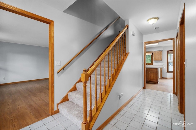 1345 William St, Sycamore, IL 60178 - staircase with tile patterned flooring and baseboards