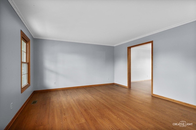 1345 William St, Sycamore, IL 60178 - empty room with wood finished floors and crown molding