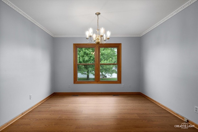 1345 William St, Sycamore, IL 60178 - spare room with a chandelier, ornamental molding, and wood finished floors