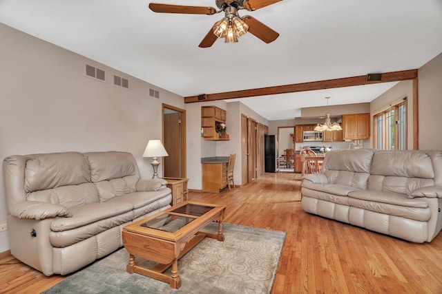 910 N Dovington Dr, Hoffman Estates, IL 60169 - living room featuring a chandelier, ceiling fan, light wood-style floors, beamed ceiling, and baseboards