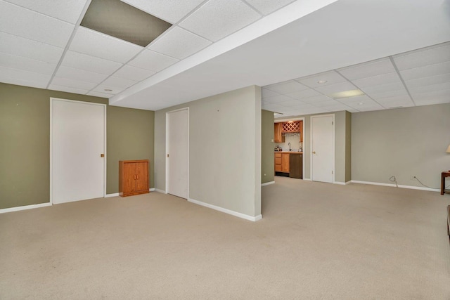 910 N Dovington Dr, Hoffman Estates, IL 60169 - finished below grade area with a drop ceiling, light colored carpet, baseboards, and a sink