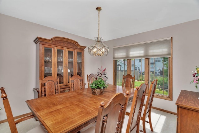 910 N Dovington Dr, Hoffman Estates, IL 60169 - dining space featuring baseboards, a chandelier, and light colored carpet