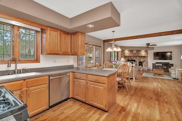 910 N Dovington Dr, Hoffman Estates, IL 60169 - kitchen featuring stainless steel dishwasher, a sink, range with gas stovetop, open floor plan, and a peninsula