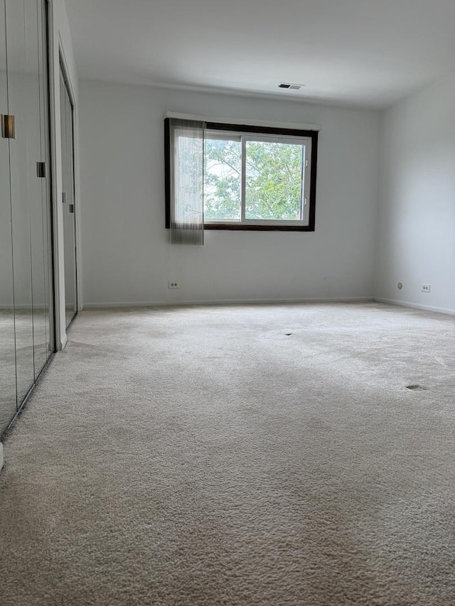 4100 Cove Ln Unit F, Glenview, IL 60025 - unfurnished room featuring light colored carpet
