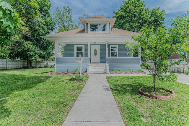 452 Addison St, Elgin, IL 60120 - bungalow-style house featuring covered porch and a shingled roof