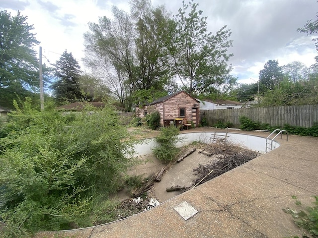 920 16th St, Rockford, IL 61104 - fenced backyard featuring an outbuilding and a patio