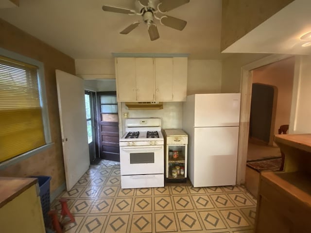 920 16th St, Rockford, IL 61104 - kitchen featuring white appliances, under cabinet range hood, and ceiling fan
