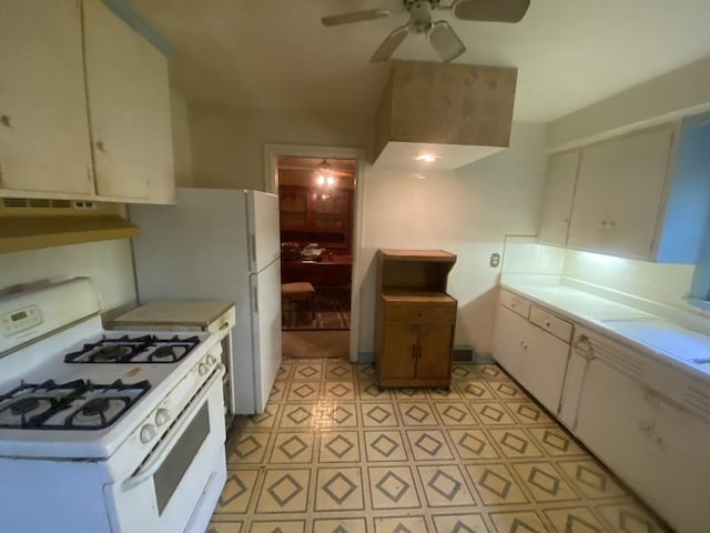 920 16th St, Rockford, IL 61104 - kitchen with gas range gas stove, under cabinet range hood, a ceiling fan, light countertops, and light flooring