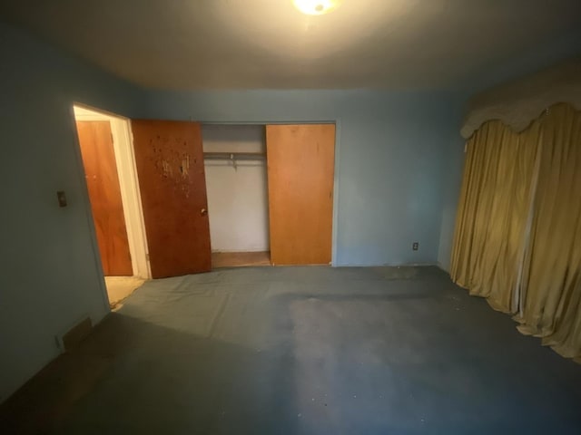 920 16th St, Rockford, IL 61104 - unfurnished bedroom with concrete flooring and a closet