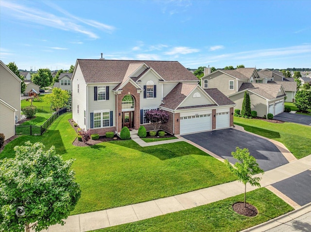 17022 S Creighton Dr, Lockport, IL 60441 - traditional home featuring a garage, driveway, a residential view, and brick siding