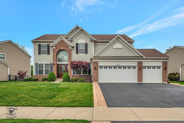 17022 S Creighton Dr, Lockport, IL 60441 - traditional home featuring brick siding, asphalt driveway, an attached garage, and a front yard
