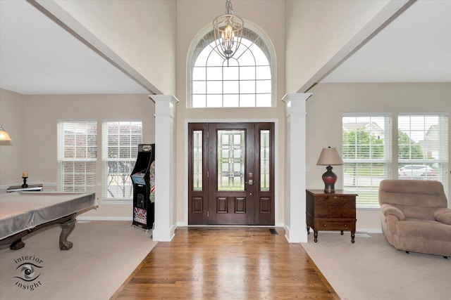 17022 S Creighton Dr, Lockport, IL 60441 - foyer with decorative columns, a chandelier, wood finished floors, baseboards, and a towering ceiling