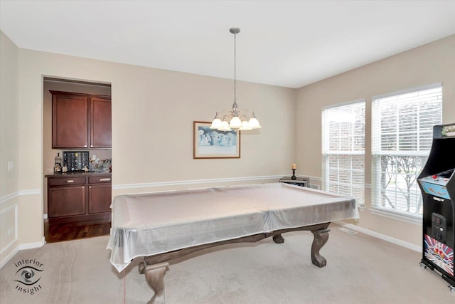 17022 S Creighton Dr, Lockport, IL 60441 - rec room with light carpet, baseboards, and a chandelier