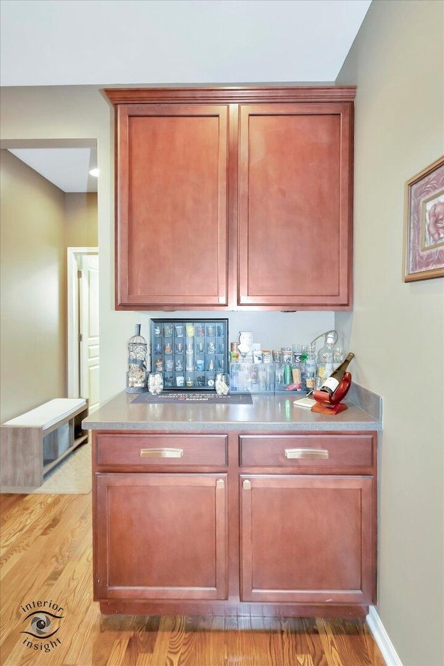 17022 S Creighton Dr, Lockport, IL 60441 - indoor dry bar with light wood-type flooring
