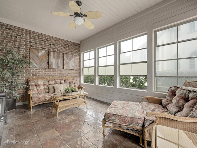 158 Los Lagos Dr, Bloomingdale, IL 60108 - sunroom / solarium with brick wall, an outdoor hangout area, a ceiling fan, and stone tile flooring
