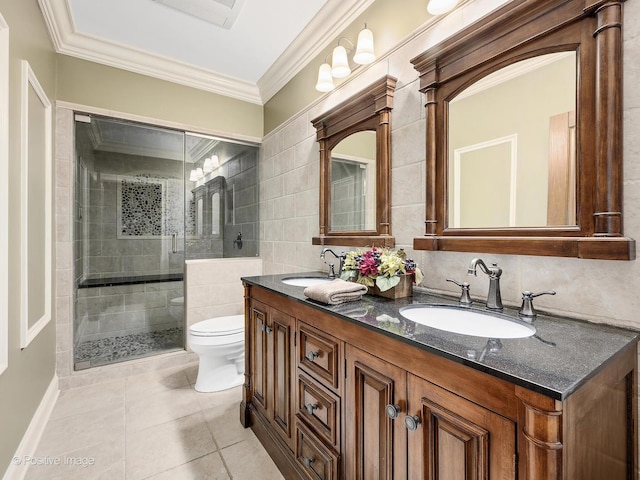 158 Los Lagos Dr, Bloomingdale, IL 60108 - full bathroom featuring toilet, double vanity, a shower stall, tile patterned floors, and tile walls