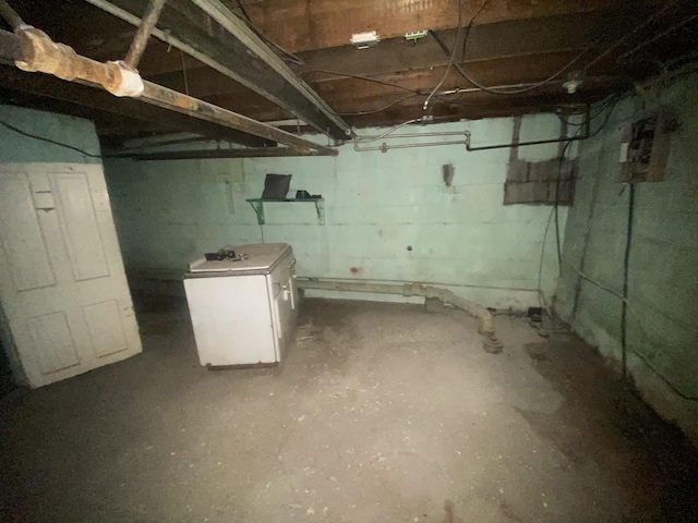 1306 Magnolia St, Rockford, IL 61104 - unfinished below grade area featuring refrigerator
