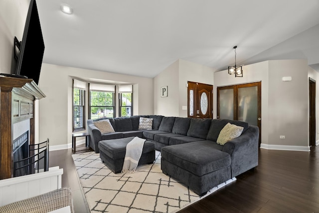 304 Turnbridge Dr, Shorewood, IL 60404 - living area with vaulted ceiling, wood finished floors, baseboards, and a tile fireplace