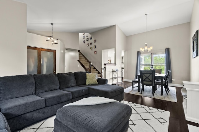 304 Turnbridge Dr, Shorewood, IL 60404 - living room with a chandelier, high vaulted ceiling, dark wood-type flooring, stairs, and baseboards