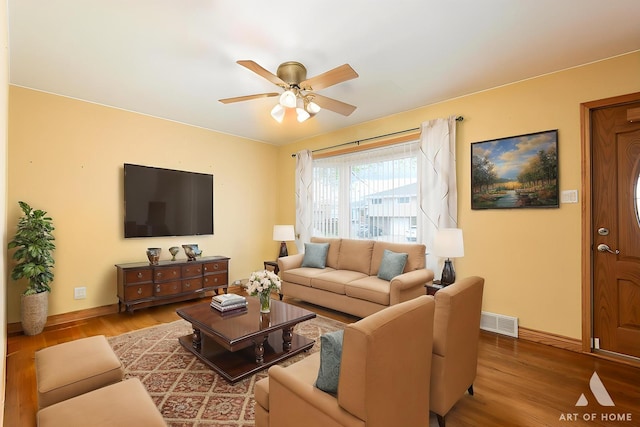 4010 Bobby Ln, Schiller Park, IL 60176 - living area with wood finished floors, a ceiling fan, and baseboards