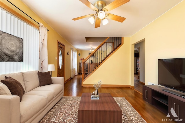 4010 Bobby Ln, Schiller Park, IL 60176 - living area with stairway, wood finished floors, ceiling fan, and baseboards