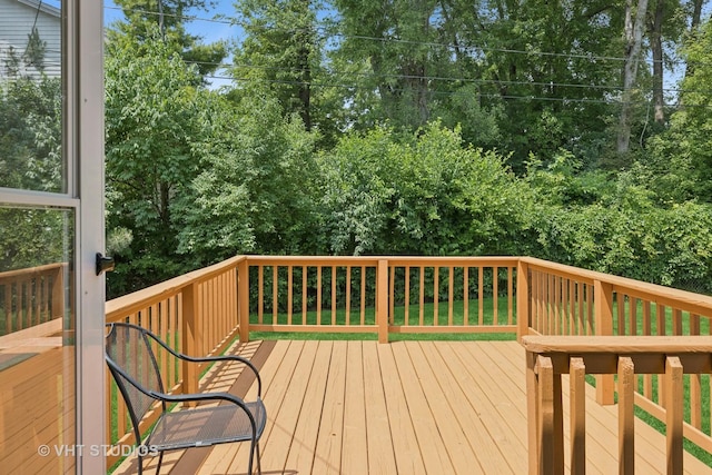415 W N Blvd, Mchenry, IL 60051 - wooden terrace with view of wooded area