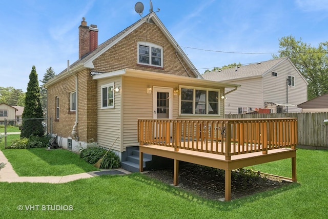 415 W N Blvd, Mchenry, IL 60051 - rear view of house with a chimney, brick siding, and a wooden deck