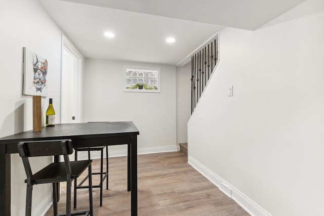 9817 S Ellis Ave, Chicago, IL 60628 - dining area with baseboards, stairs, light wood finished floors, and recessed lighting
