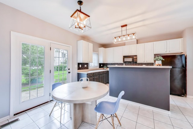 31905 Millard Cir, Warrenville, IL 60555 - kitchen featuring black appliances, white cabinets, light countertops, and tasteful backsplash