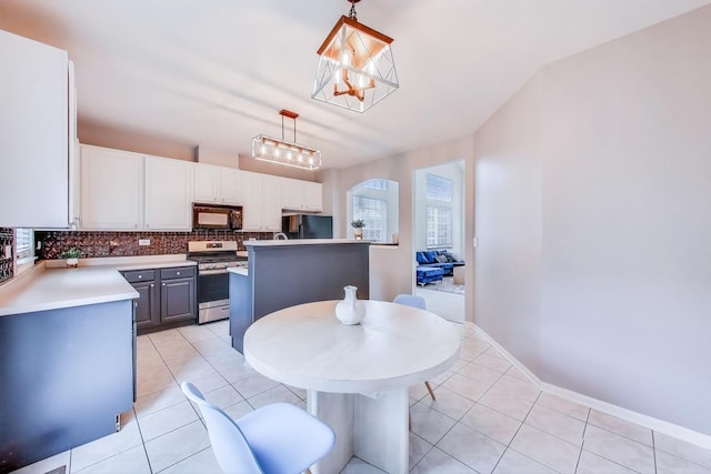 31905 Millard Cir, Warrenville, IL 60555 - kitchen with black appliances, backsplash, light tile patterned floors, a chandelier, and hanging light fixtures