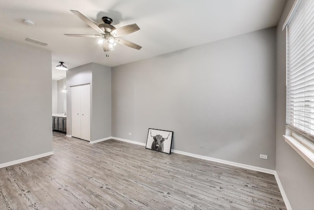 31905 Millard Cir, Warrenville, IL 60555 - spare room with a ceiling fan, light wood finished floors, and baseboards