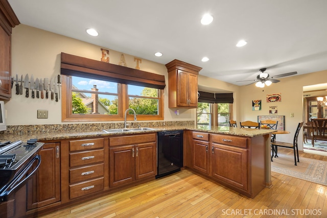 26W568 Lindsey Ave, Winfield, IL 60190 - kitchen with black appliances, a sink, light wood-style flooring, brown cabinetry, and recessed lighting
