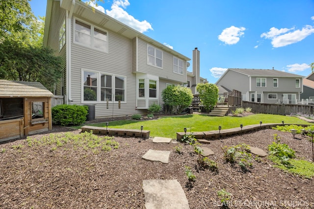 26W568 Lindsey Ave, Winfield, IL 60190 - back of property featuring a deck, a chimney, and a residential view