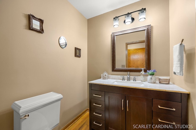 26W568 Lindsey Ave, Winfield, IL 60190 - half bath with vanity, toilet, and wood finished floors