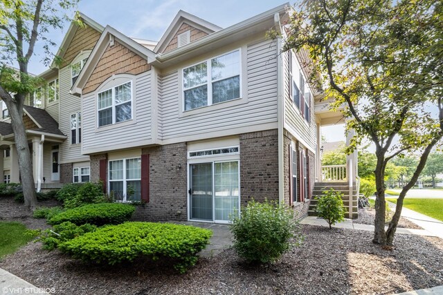 1292 Georgetown Way Unit 1292, Vernon Hills, IL 60061 - view of property exterior with brick siding