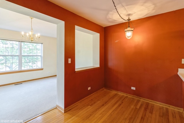 1292 Georgetown Way Unit 1292, Vernon Hills, IL 60061 - unfurnished dining area featuring a chandelier and hardwood / wood-style floors