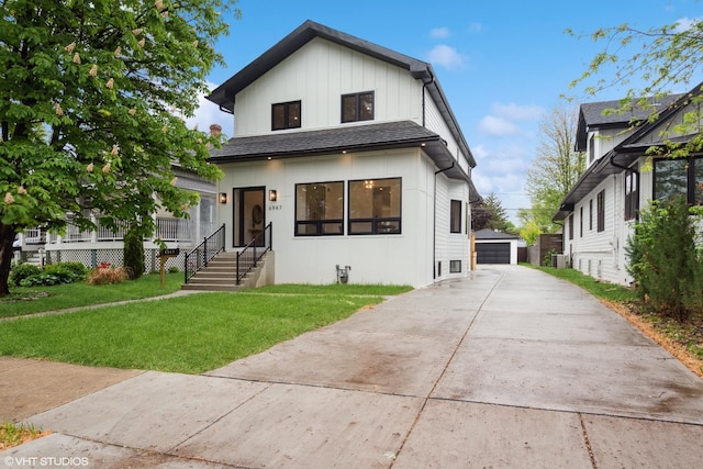 6947 N Overhill Ave, Chicago, IL 60631 - view of front of home featuring a front yard, an outdoor structure, and a garage