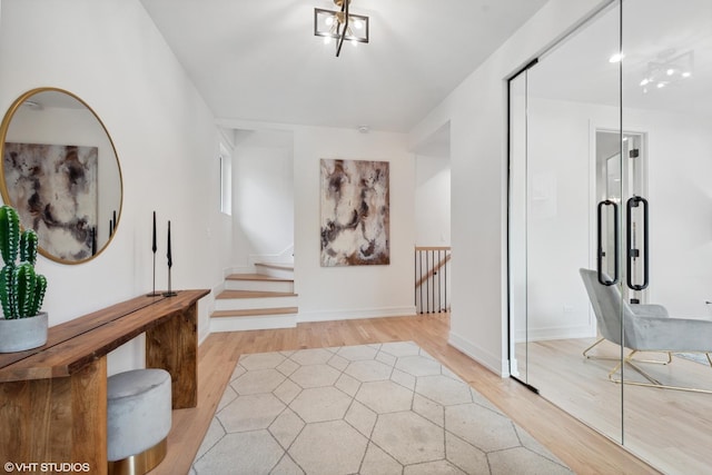 6947 N Overhill Ave, Chicago, IL 60631 - entryway with light wood-style flooring, stairway, and baseboards